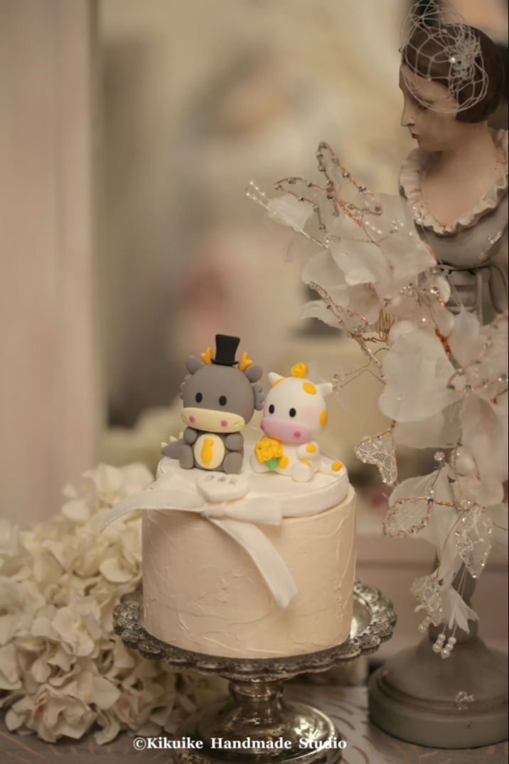 cow and dragon wedding cake topper