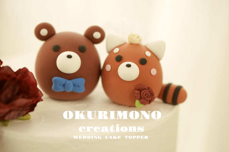 red panda and bear wedding cake topper