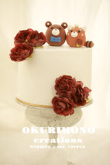 red panda and bear wedding cake topper