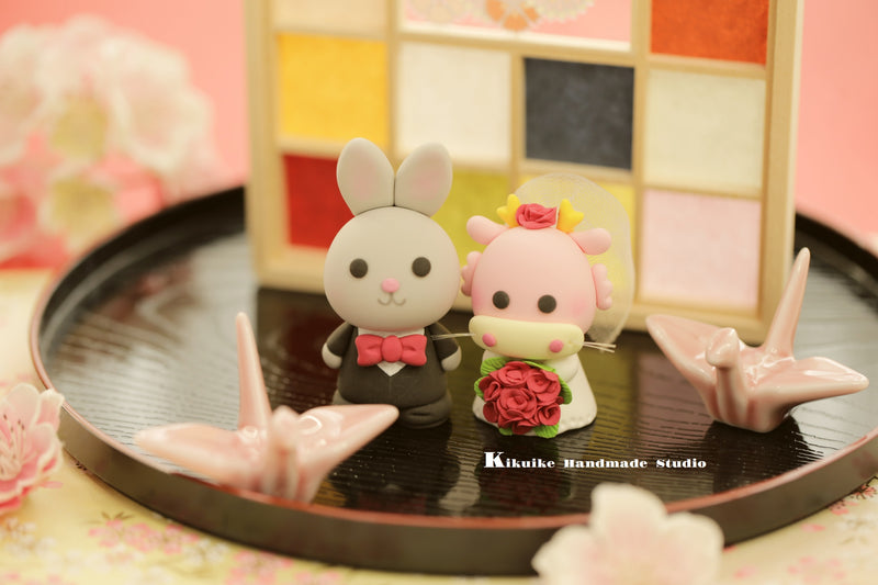 bunny and dragon wedding cake topper