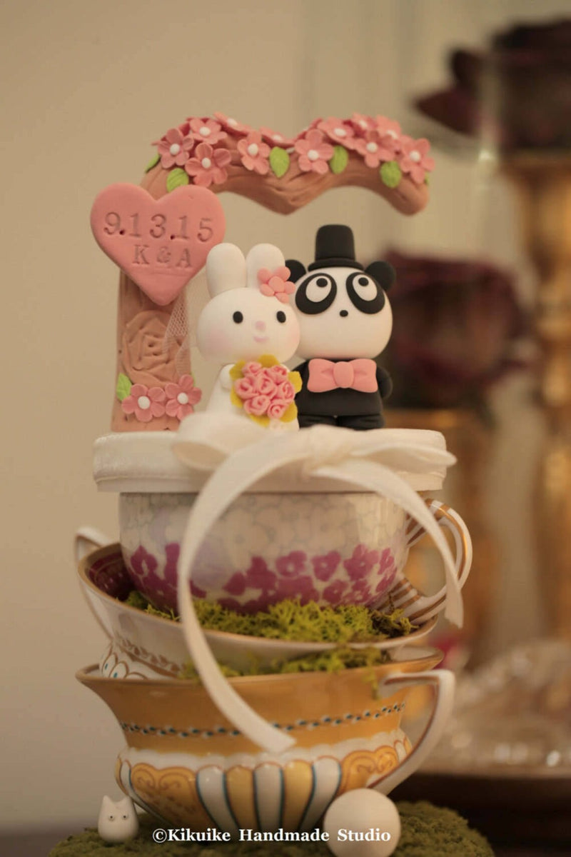 panda and bunny wedding cake topper