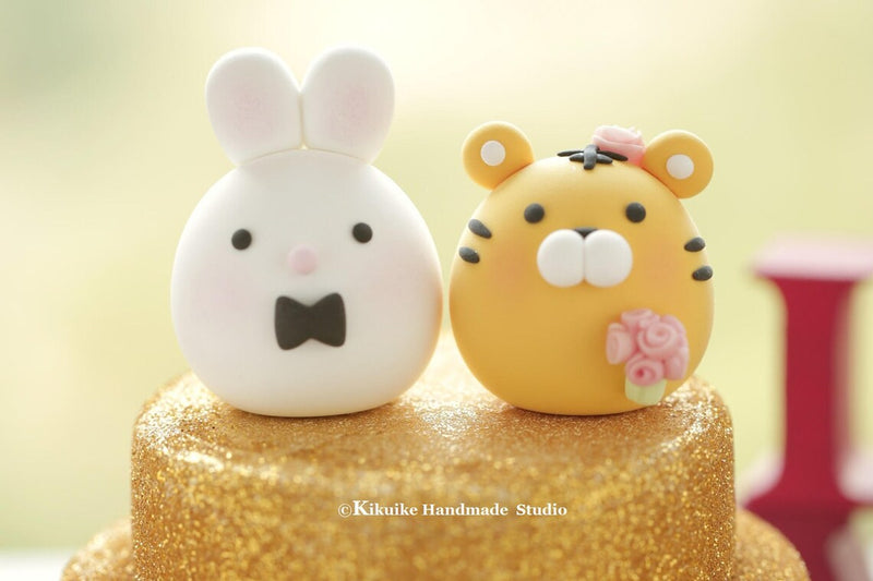bunny and tiger wedding cake topper