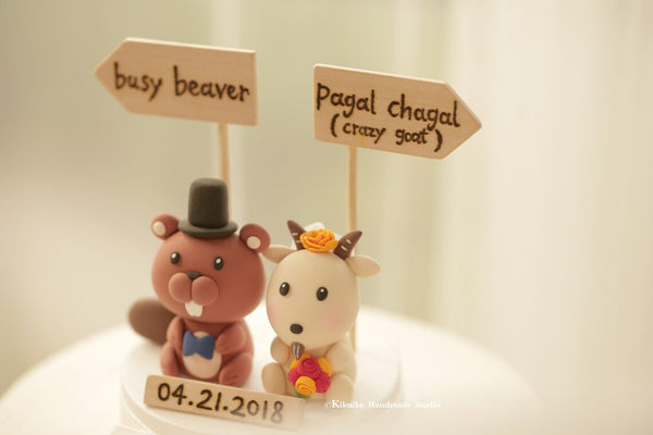 beaver and goat wedding cake topper