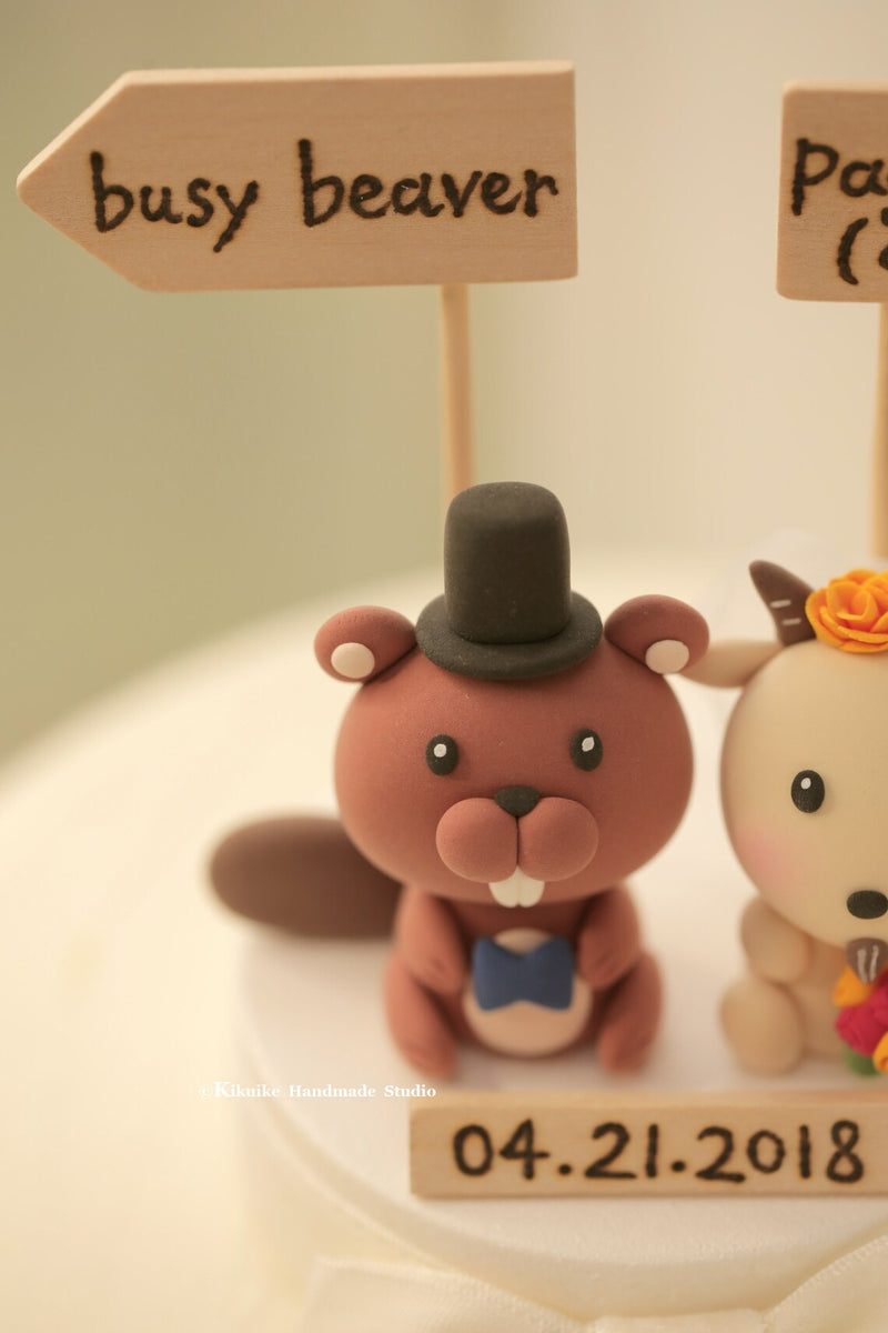 beaver and goat wedding cake topper