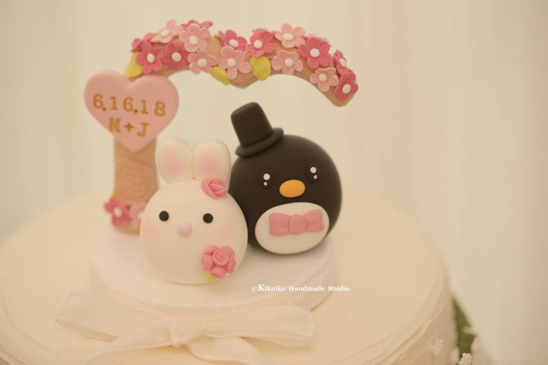 bunny and penguin wedding cake topper