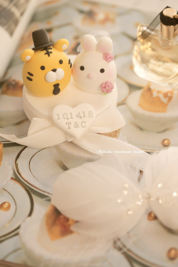 bunny and tiger wedding cake topper