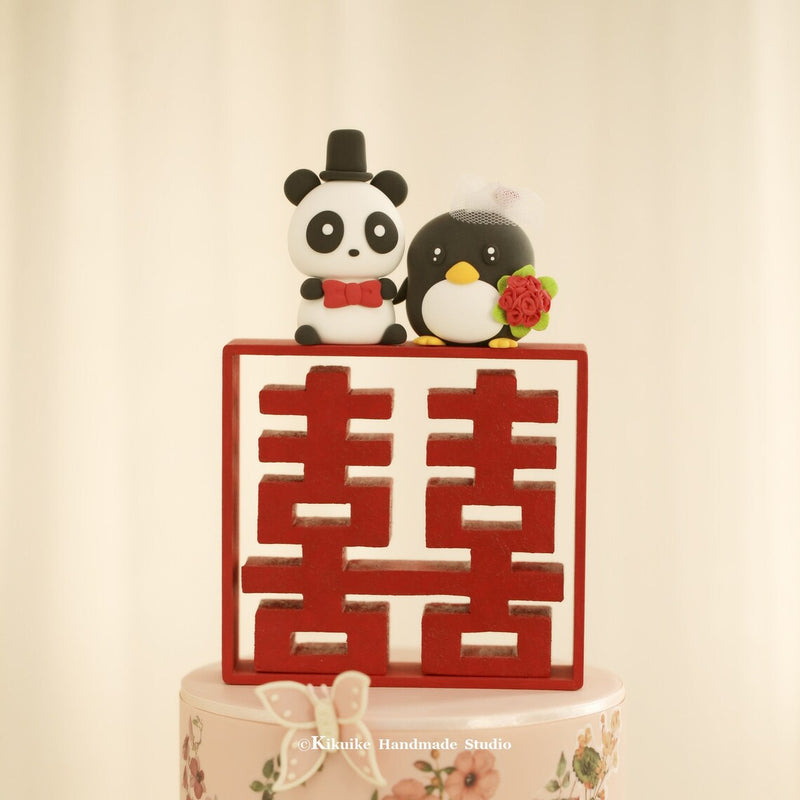 penguin and panda wedding cake topper