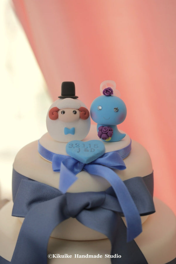 sheep and snake wedding cake topper